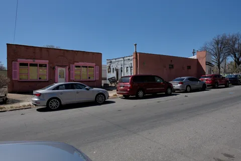 a view of a cars parked in front of a building