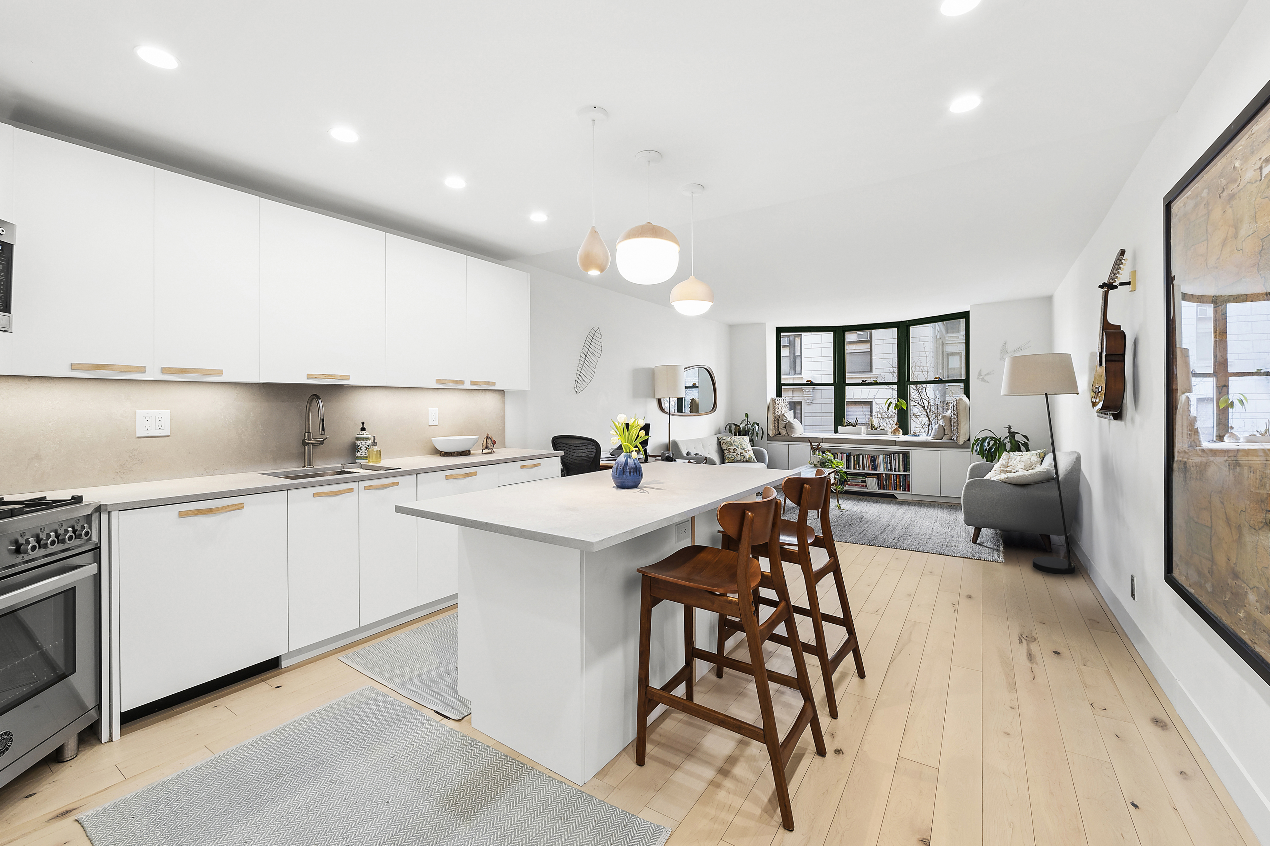 2250 Broadway, Unit 3E Manhattan, NY 10024 - Photo 1 of 13 a kitchen with white cabinets and sink