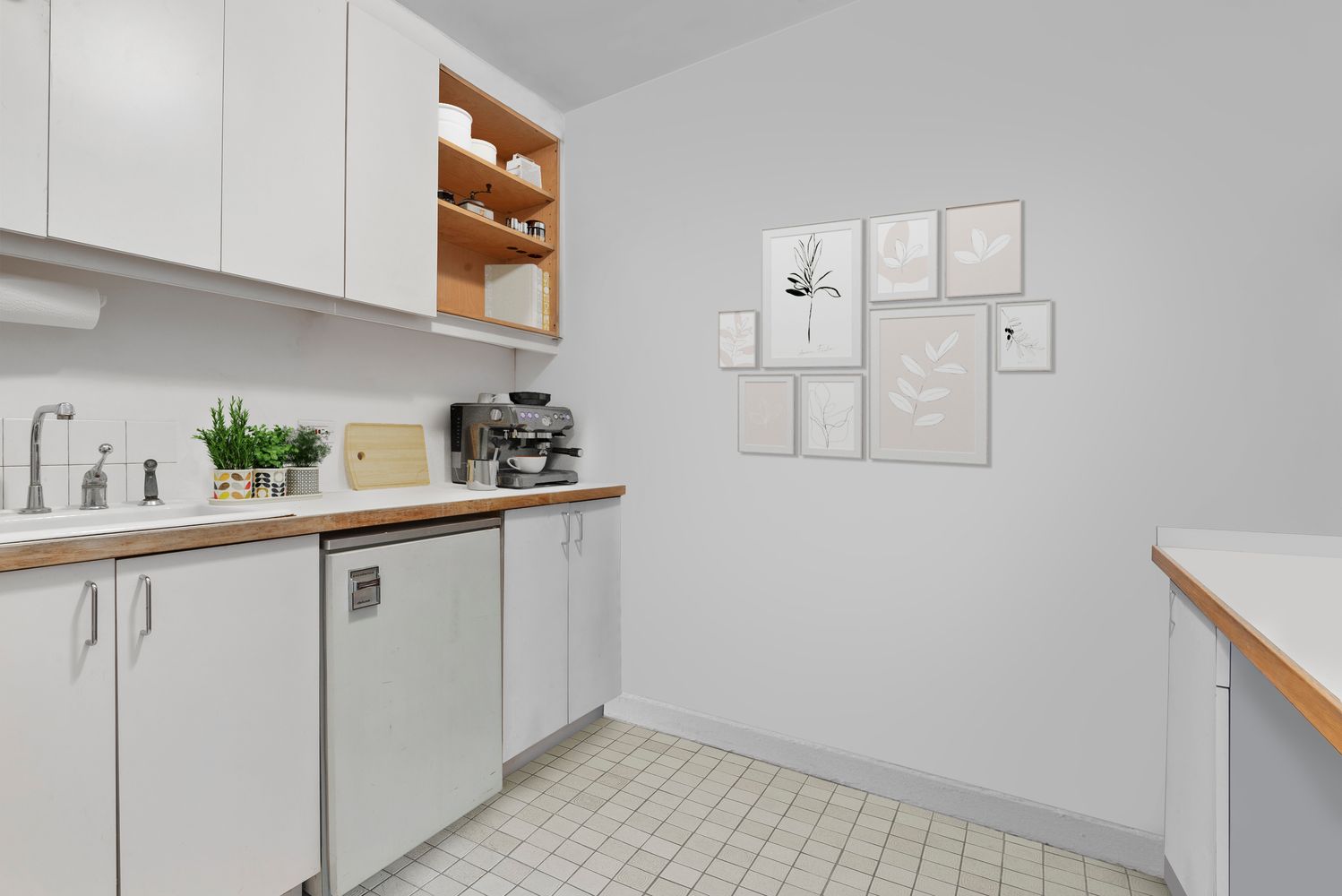 a kitchen with cabinets and window