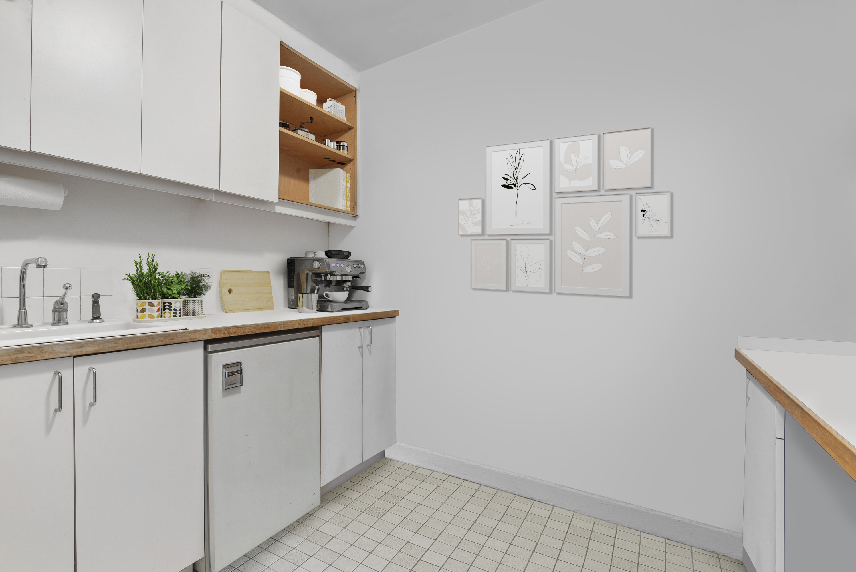 221 East 50th Street, Unit 8B Manhattan, NY 10022 - Photo 7 of 9 a kitchen with cabinets and window