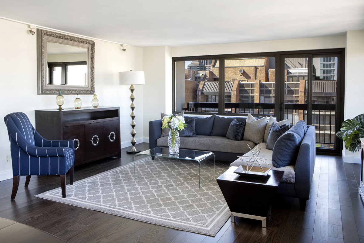 300 East 59th Street, Unit 3105 Manhattan, NY 10022 - Photo 2 of 21 a living room with furniture and a large window