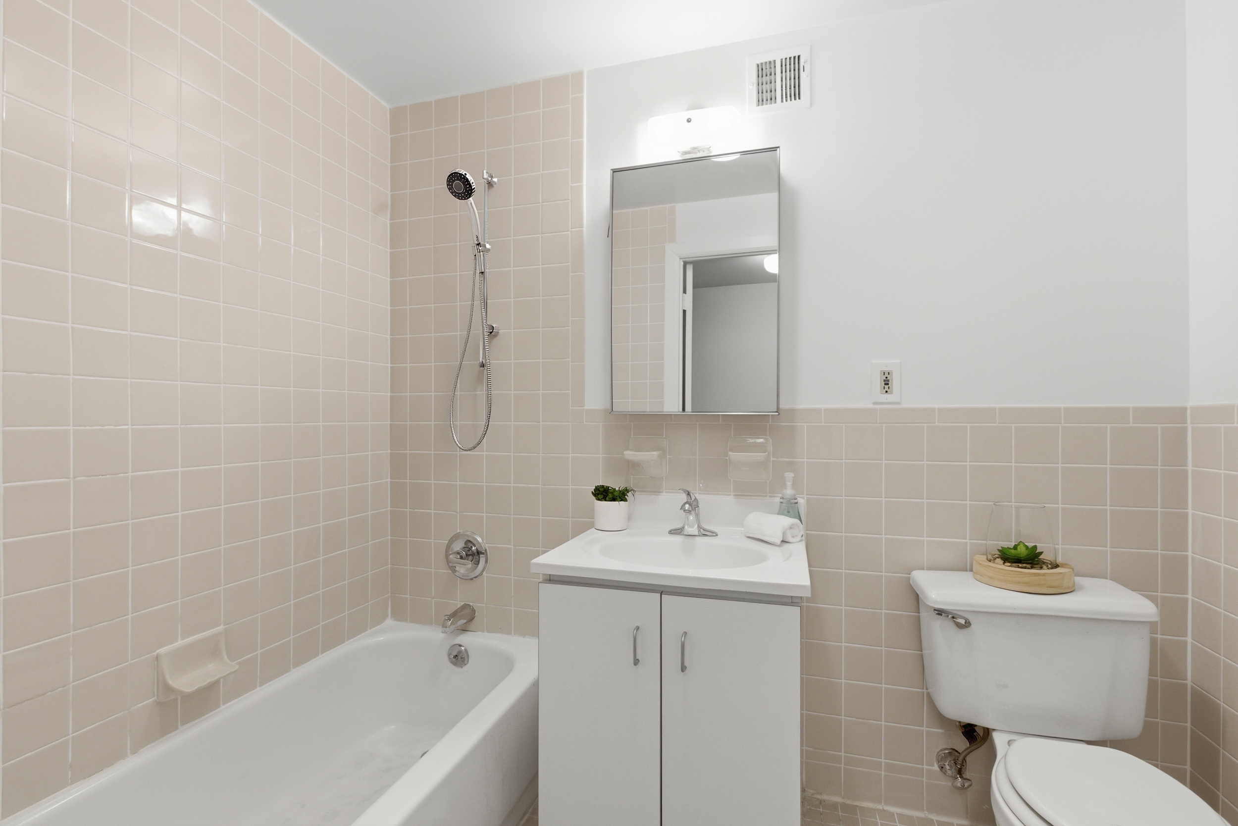 20 East 126th Street Manhattan, NY 10035 - Photo 9 of 19 a bathroom with a sink toilet tub and shower