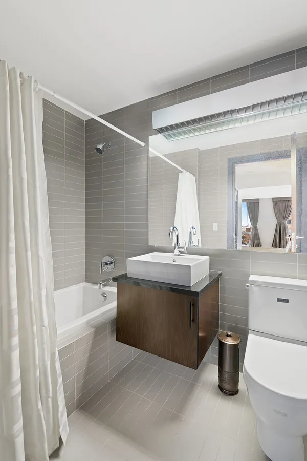 a bathroom with a sink a toilet and a bathtub