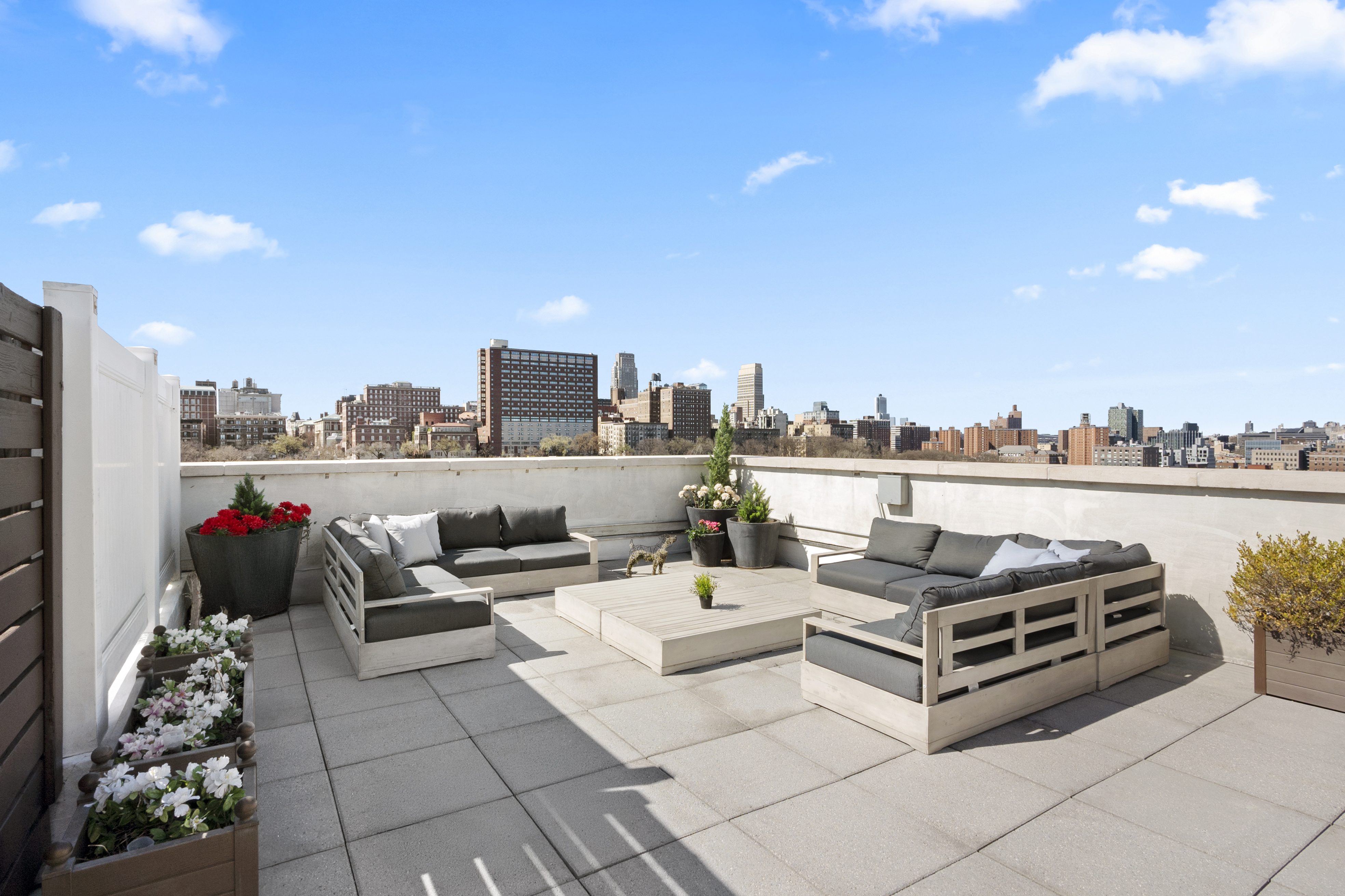 301 West 115th Street, Unit PH4C Manhattan, NY 10026 - Photo 9 of 15 a living room with furniture and a potted plant