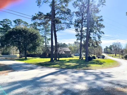 a view of a swimming pool with an buildings in the background