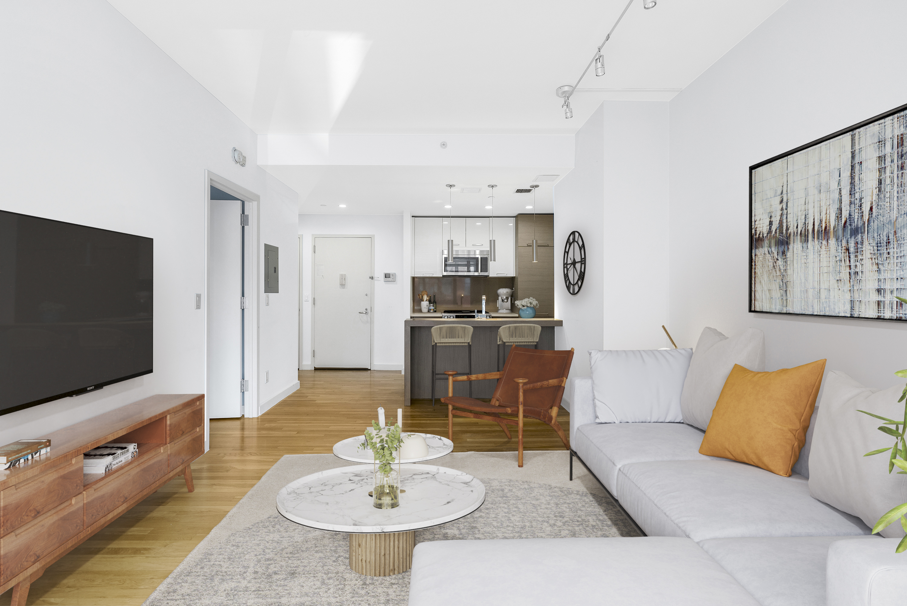 333 East 109th Street, Unit 2A Manhattan, NY 10029 - Photo 2 of 13 a living room with furniture and a flat screen tv