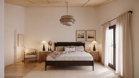 a spacious bedroom with a bed a mirror and windows