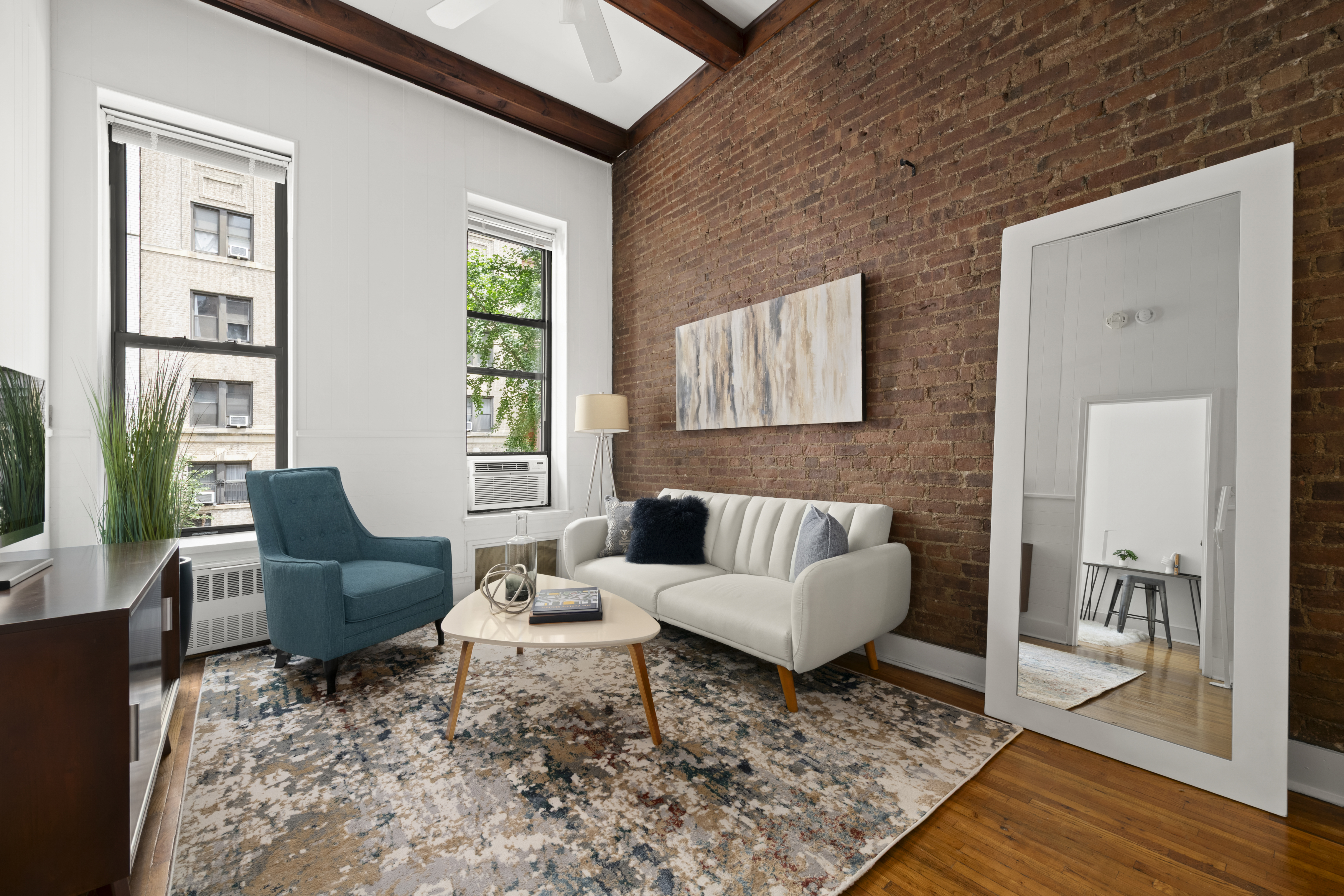 a living room with furniture and a window