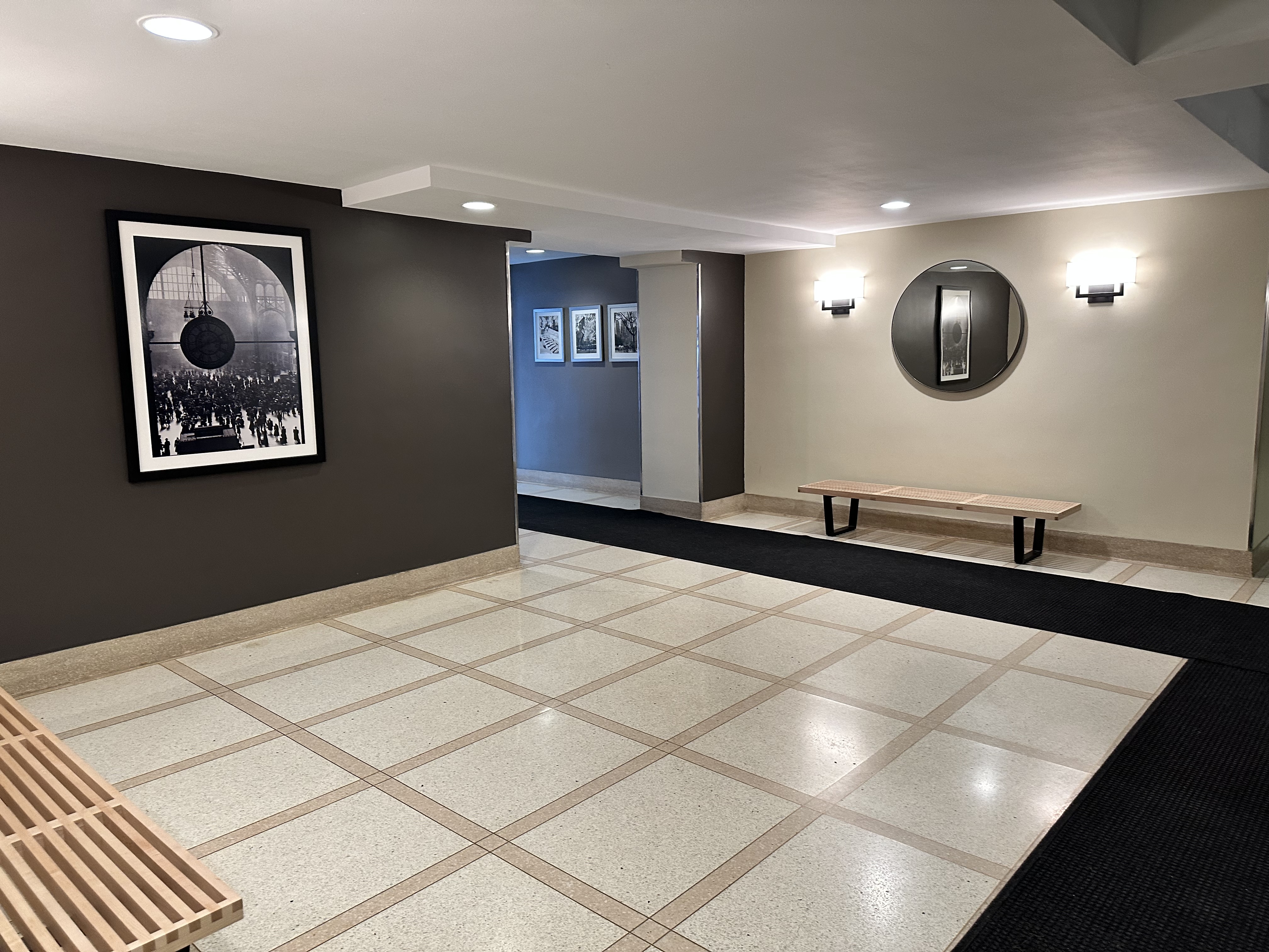 408 West 34th Street, Unit 1F Manhattan, NY 10001 - Photo 11 of 13 a bedroom with a large bed and a chandelier