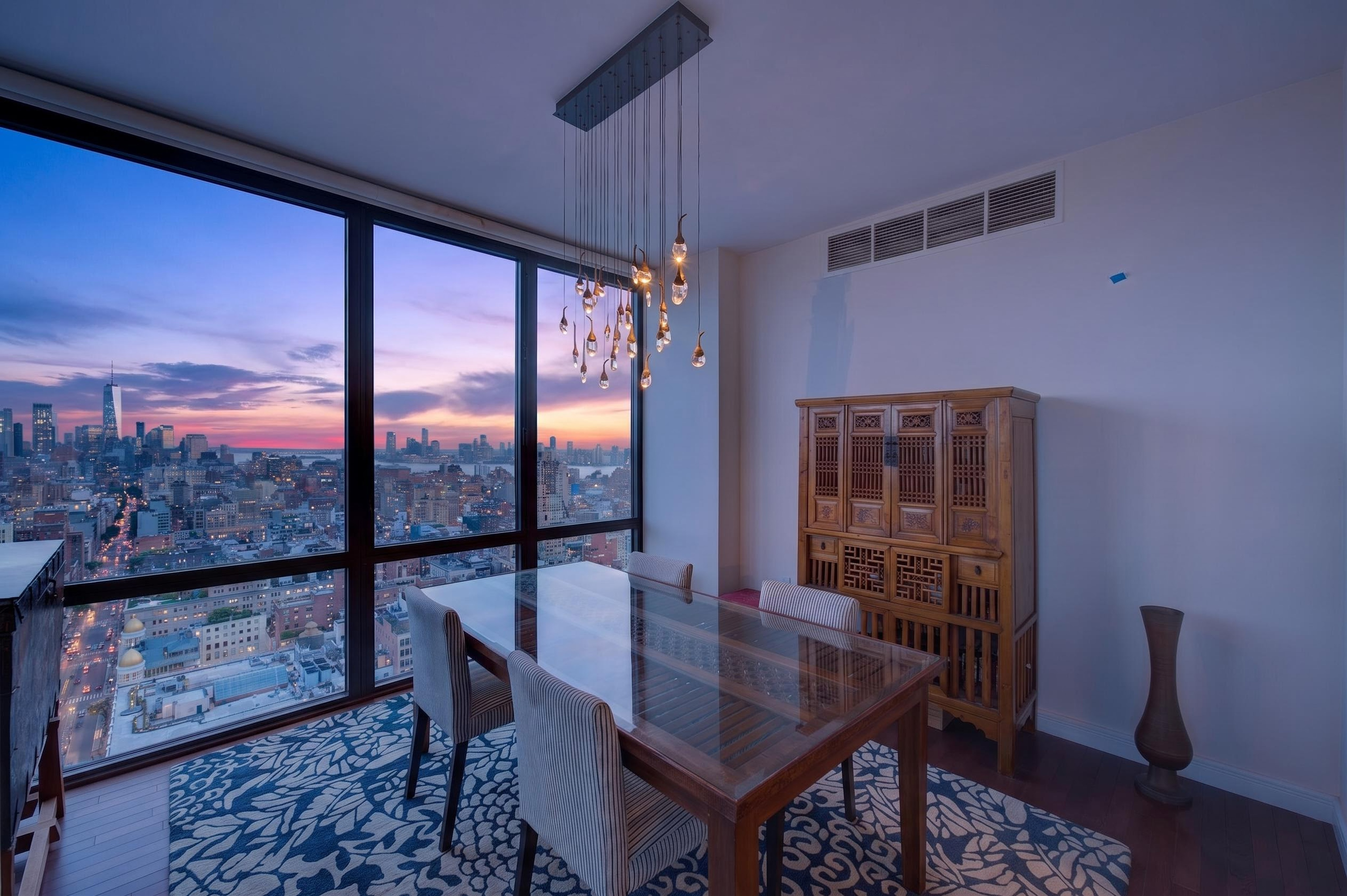 101 West 24th Street, Unit 36C Manhattan, NY 10011 - Photo 3 of 27 a view of a dining room with furniture window and wooden floor