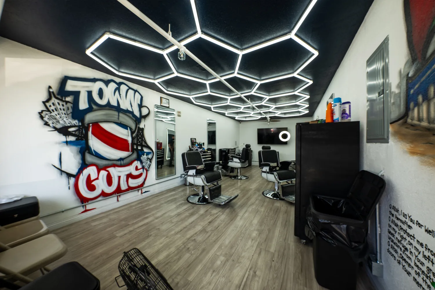 a living room with lots of furniture and a floor to ceiling window