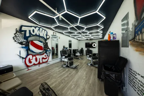 a living room with lots of furniture and a floor to ceiling window