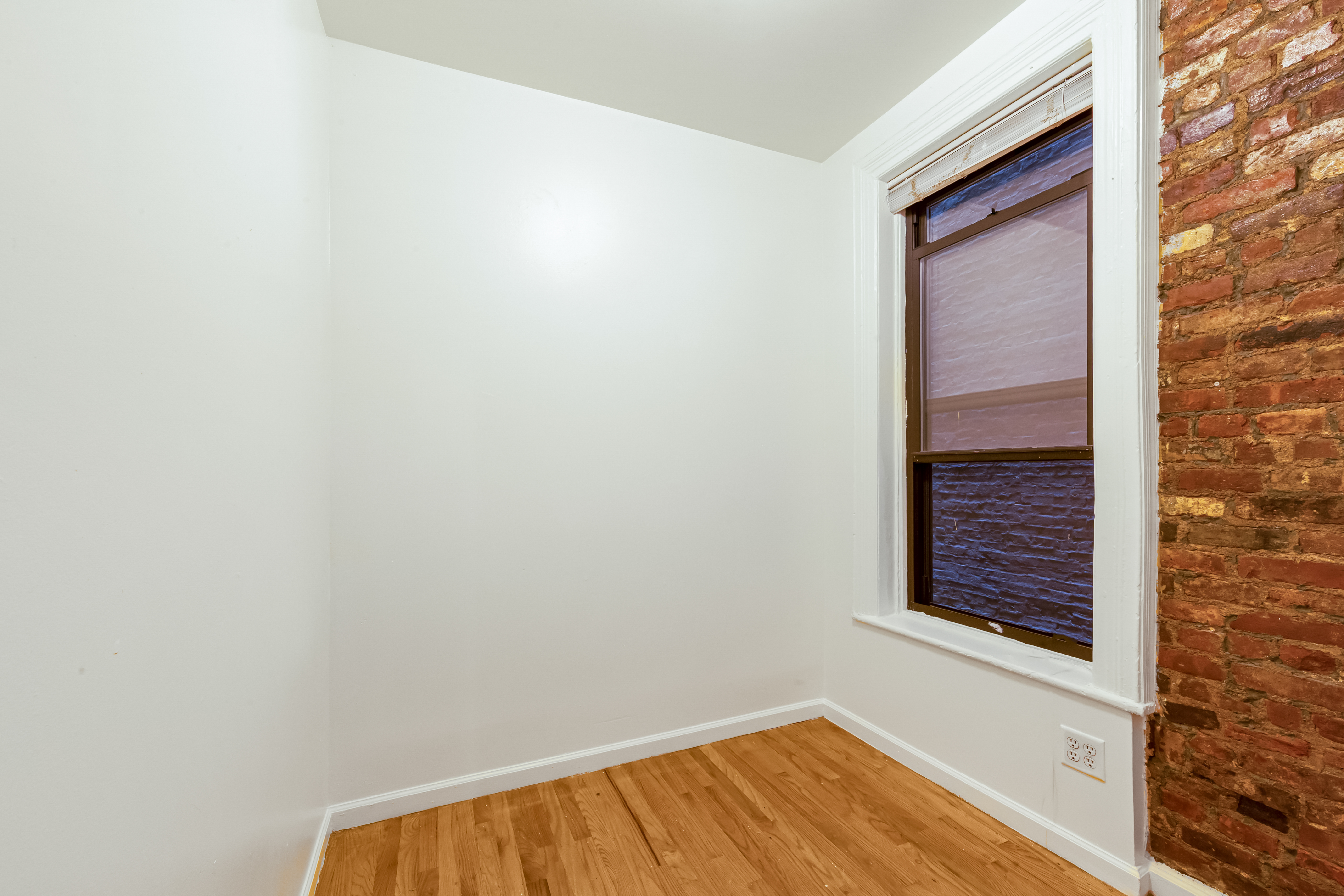 142 Sullivan Street, Unit 12 Manhattan, NY 10012 - Photo 8 of 12 a view of a small space with a window