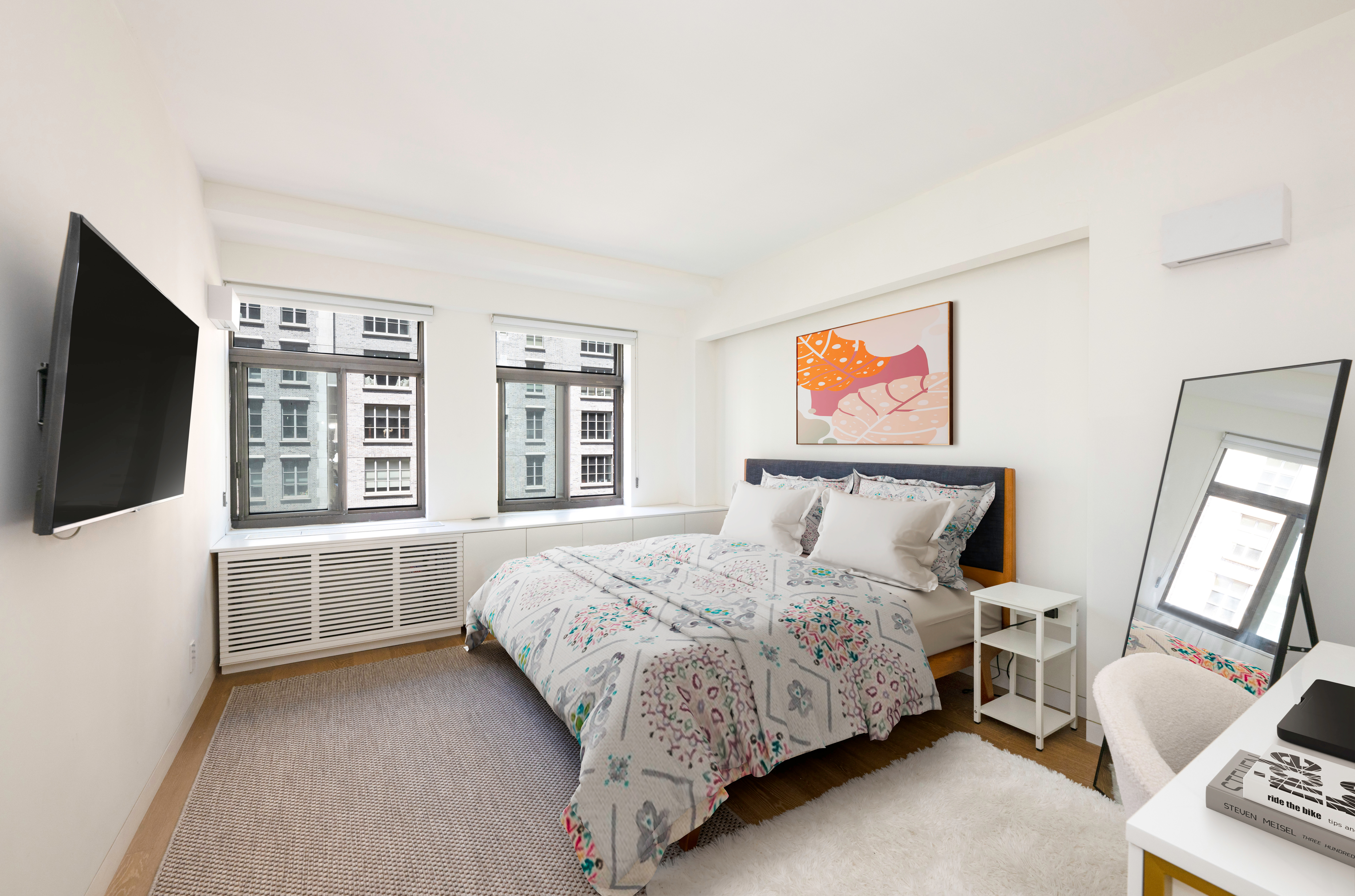 124 East 79th Street, Unit 7D Manhattan, NY 10075 - Photo 13 of 26 a spacious bedroom with a bed and a flat screen tv