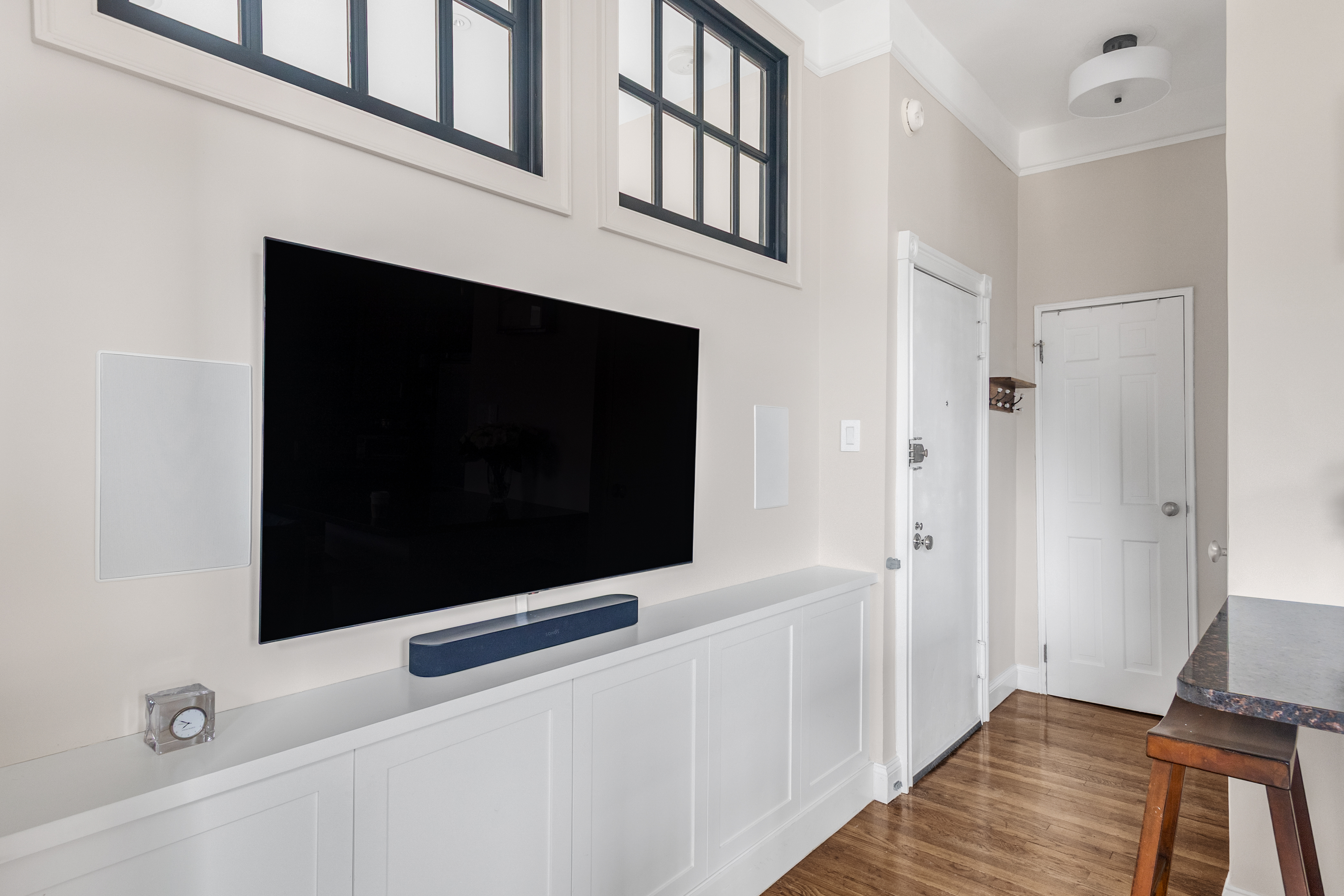 51 West 81st Street, Unit 9D Manhattan, NY 10024 - Photo 5 of 15 a living room with a fireplace and a flat screen tv
