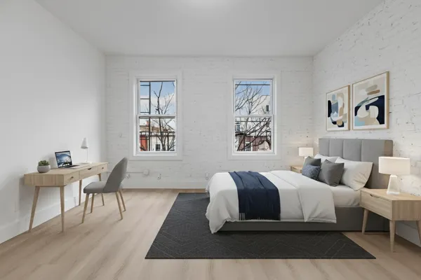 a bedroom with a large bed and a couch