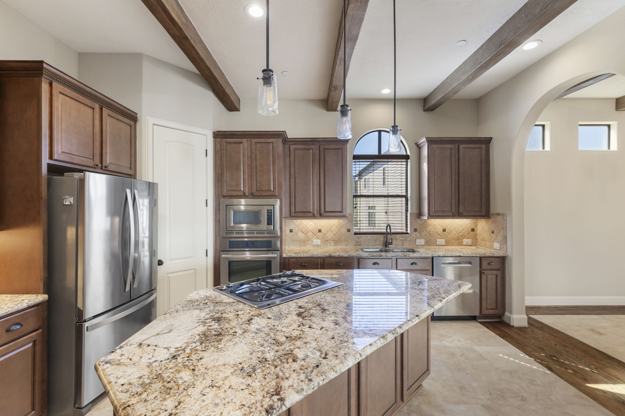 5407 Feagan Street Houston, TX 77007 - Photo 16 of 43 a kitchen with stainless steel appliances granite countertop a refrigerator a stove and a sink