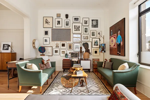 a living room with furniture rug and window