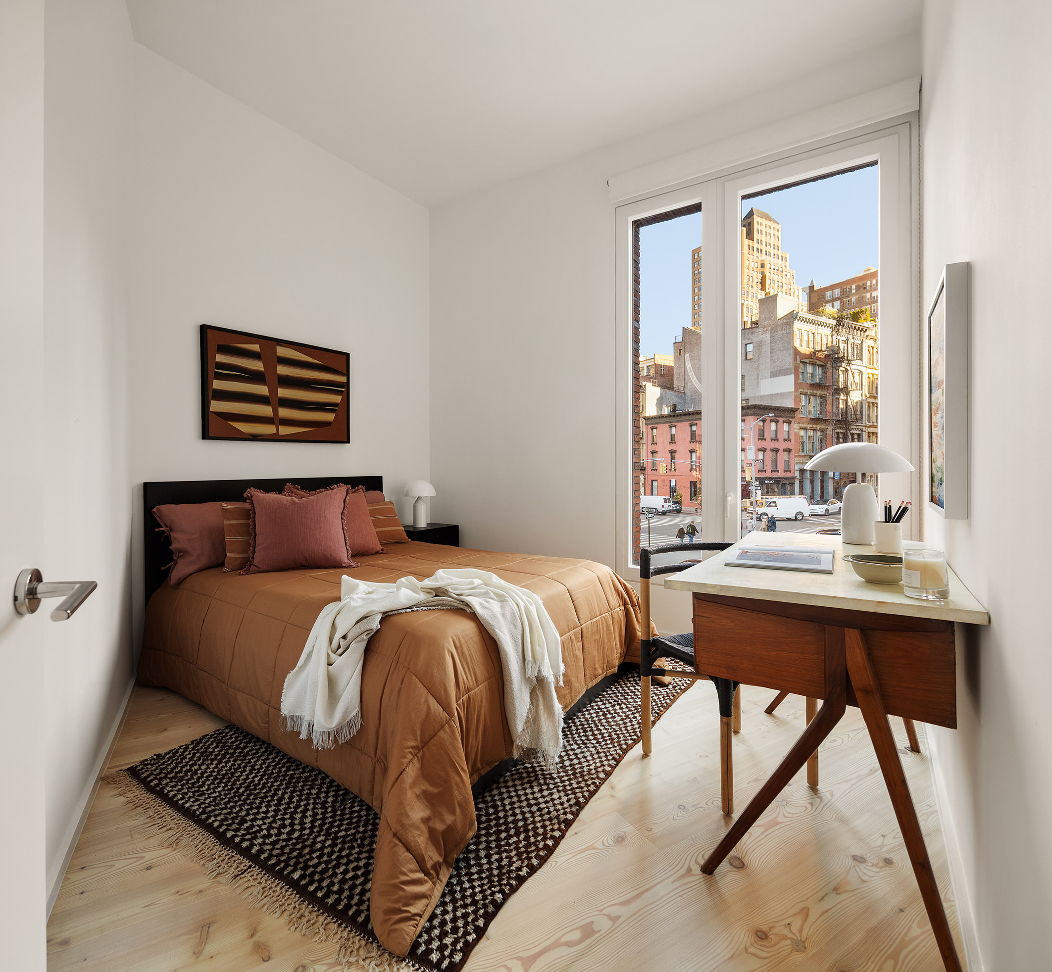 1 Avenue Of The Americas, Unit 2N Manhattan, NY 10013 - Photo 10 of 15 a bed sitting in a bedroom next to a window