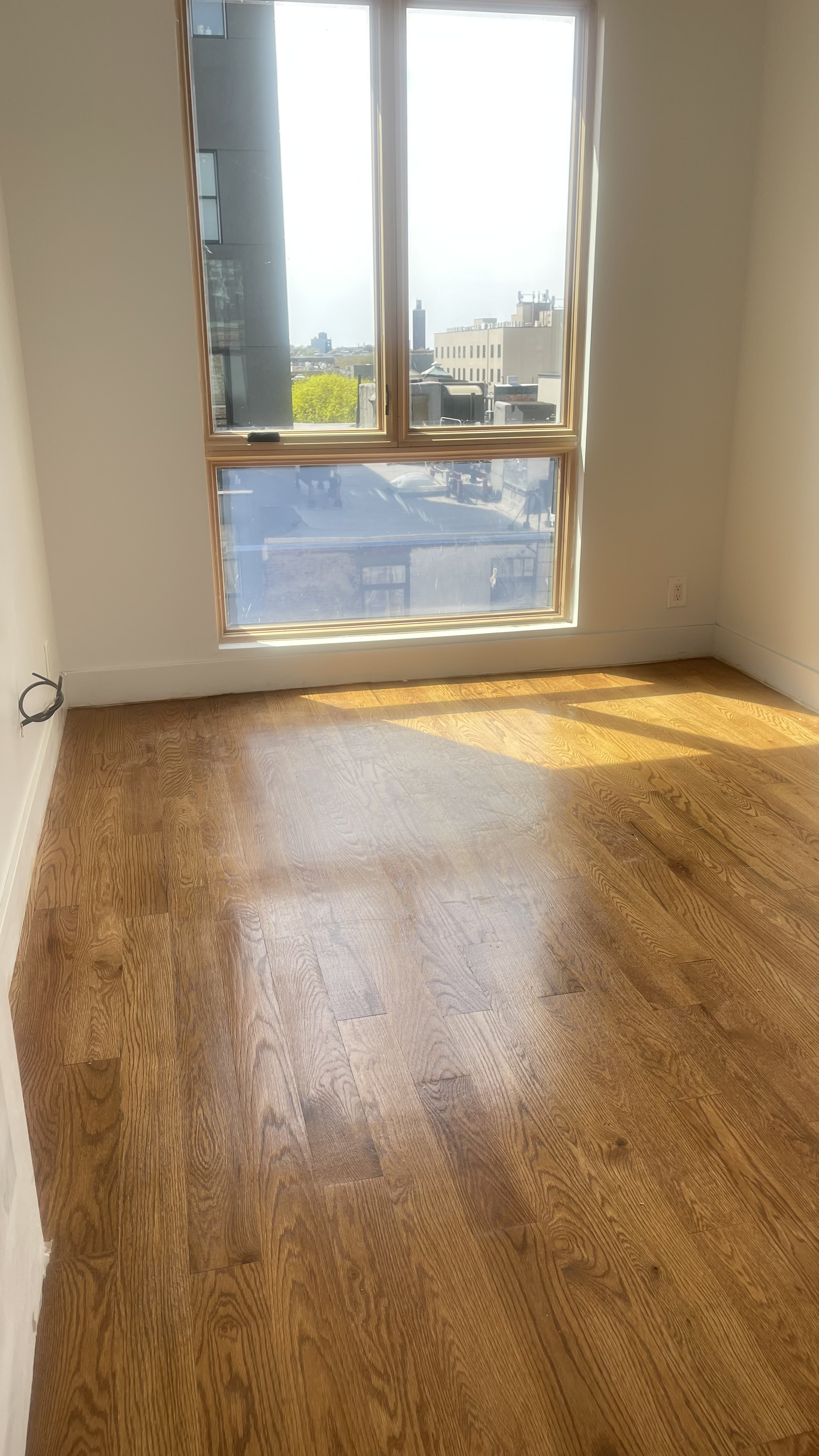 1010 Gates Avenue, Unit 6C Brooklyn, NY 11221 - Photo 5 of 9 a view of an empty room and window