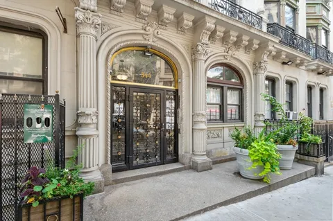a view of a large building with potted plants