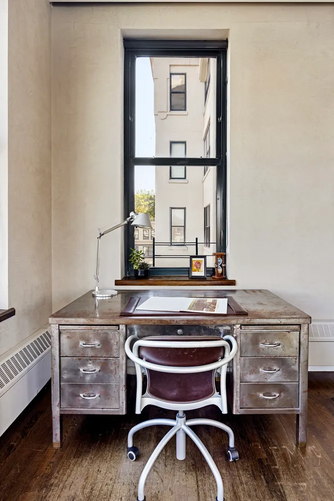 a room with a table and a mirror