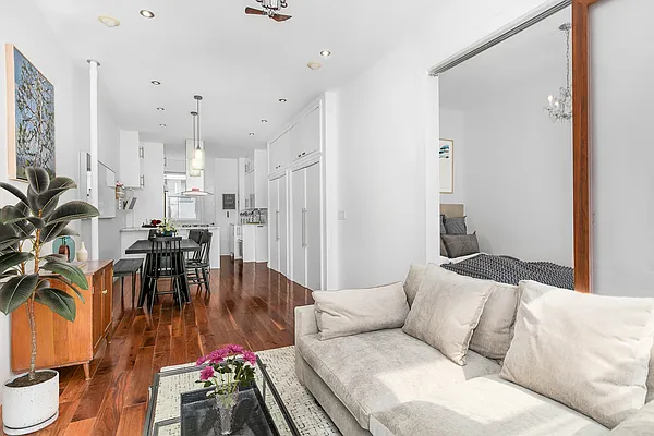 13 Downing Street, Unit 8 Manhattan, NY 10014 - Photo 3 of 10 a living room with furniture and a table