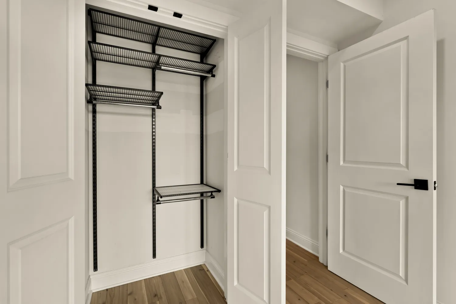 a view of walk in closet with empty racks