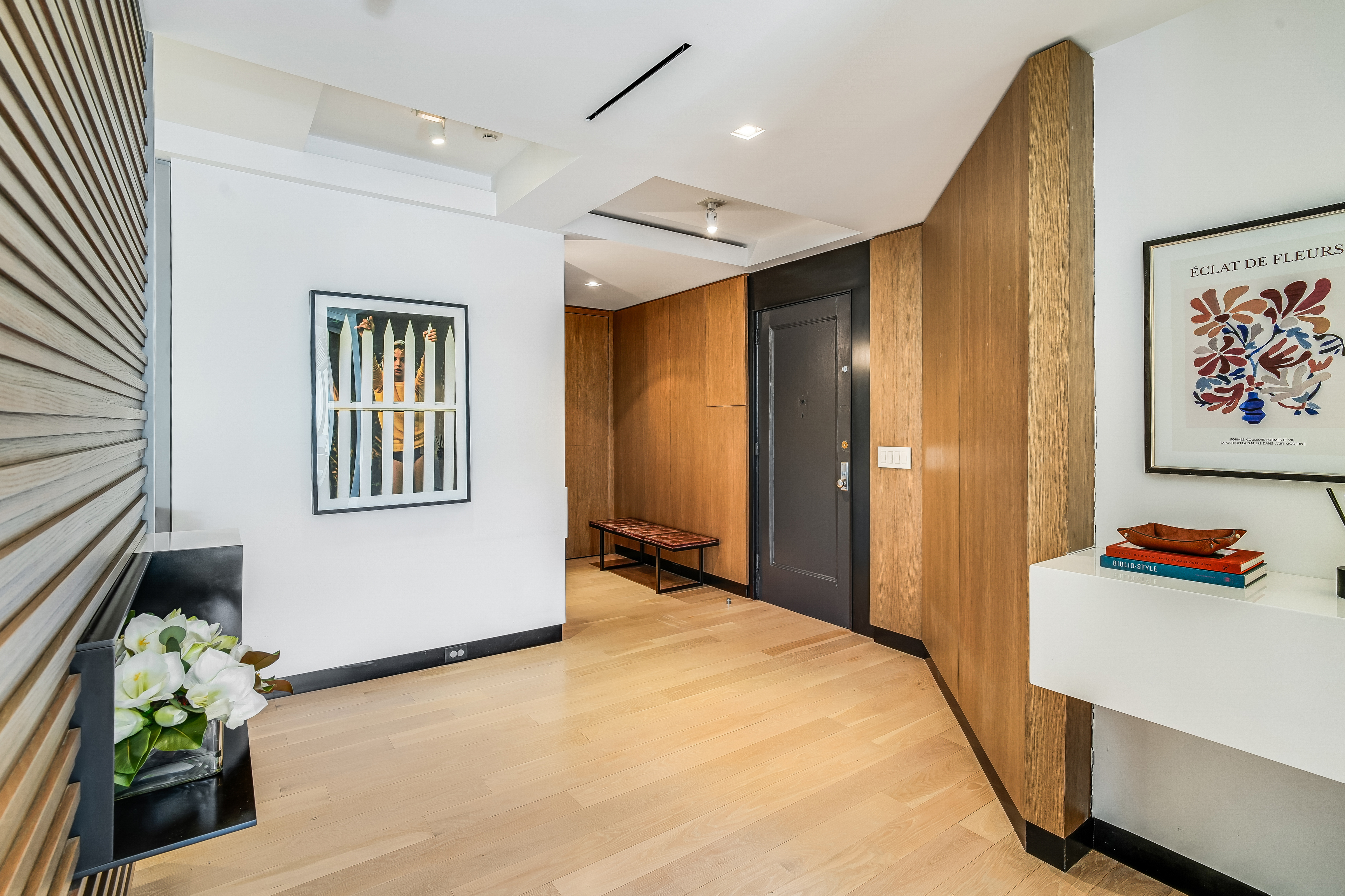 1 5th Avenue, Unit 5GH Manhattan, NY 10003 - Photo 11 of 26 a bedroom with a bed and a painting on the wall