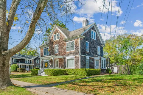 front view of a house with a yard