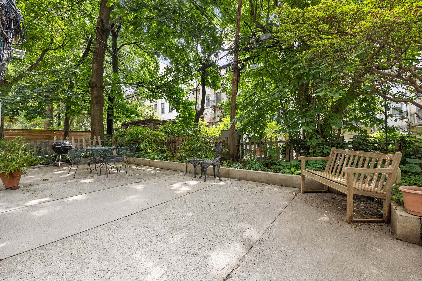 162 Garfield Place, Unit 1L Brooklyn, NY 11215 - Photo 10 of 13 a view of a bench in a backyard