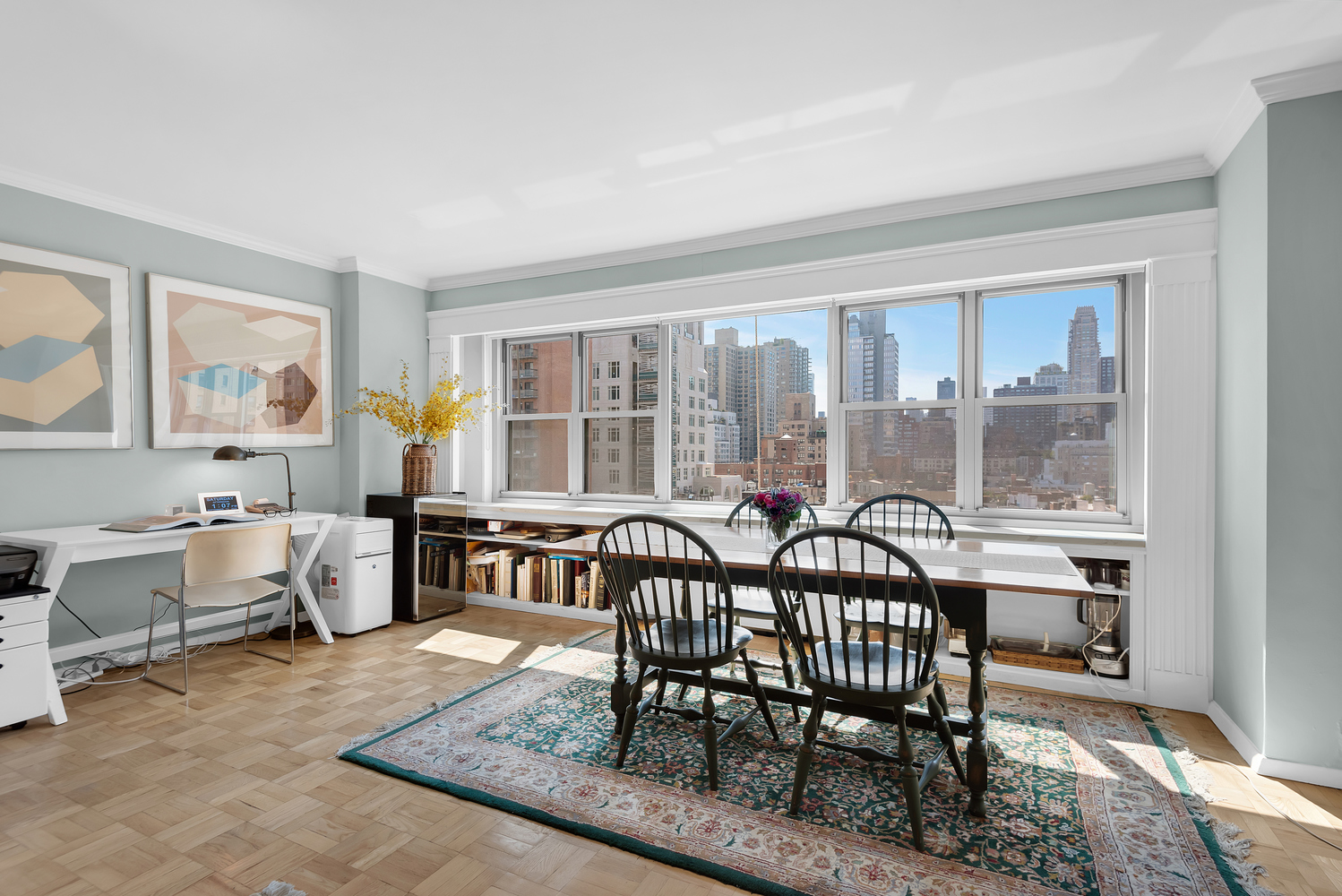 230 East 79th Street, Unit 12F Manhattan, NY 10075 - Photo 2 of 7 a view of a dining room and livingroom with furniture window and wooden floor