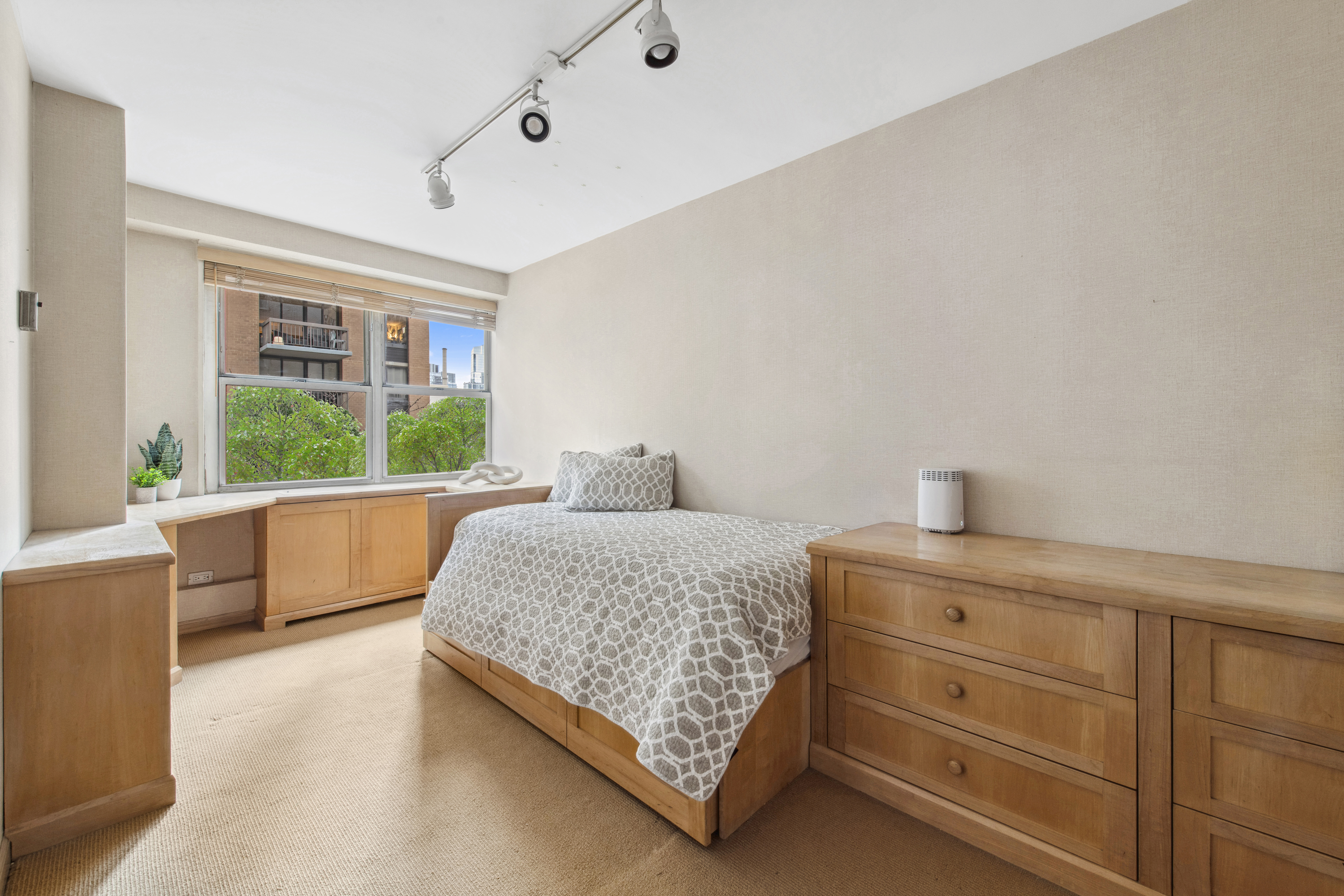 155 West 68th Street, Unit 404 Manhattan, NY 10023 - Photo 13 of 21 a living room with furniture and a window