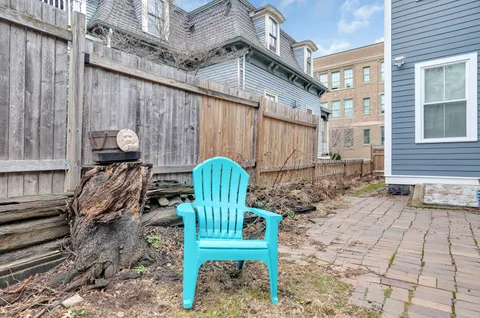 a view of a chairs with a table in the patio