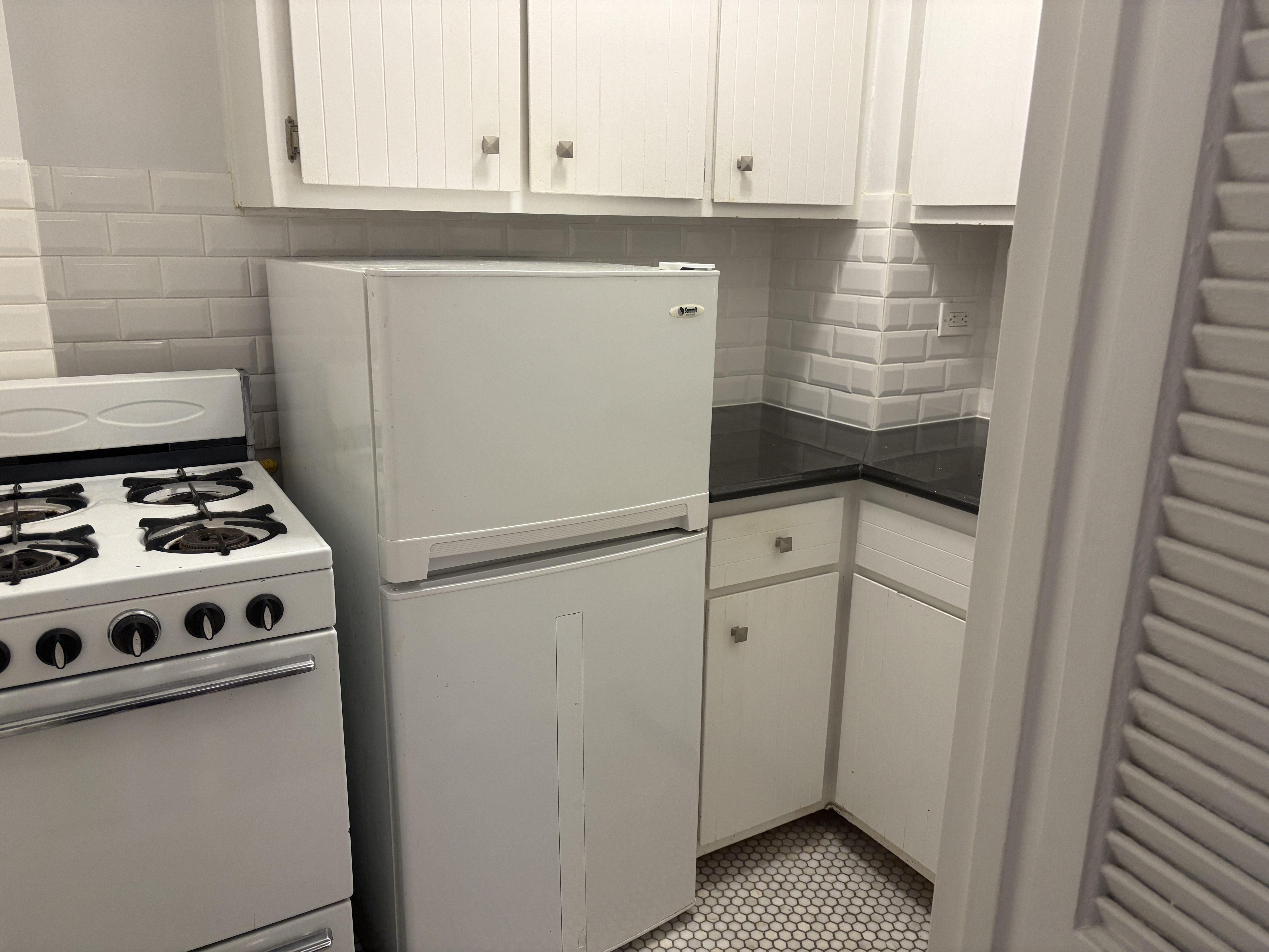 54 Orange Street, Unit 4D Brooklyn, NY 11201 - Photo 3 of 10 a kitchen with appliances and cabinets