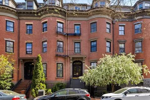 a front view of a multi story residential apartment building