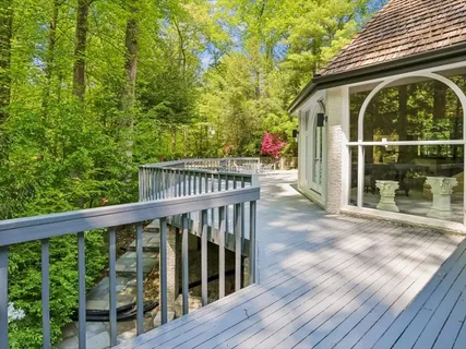 a view of a wooden house with a porch