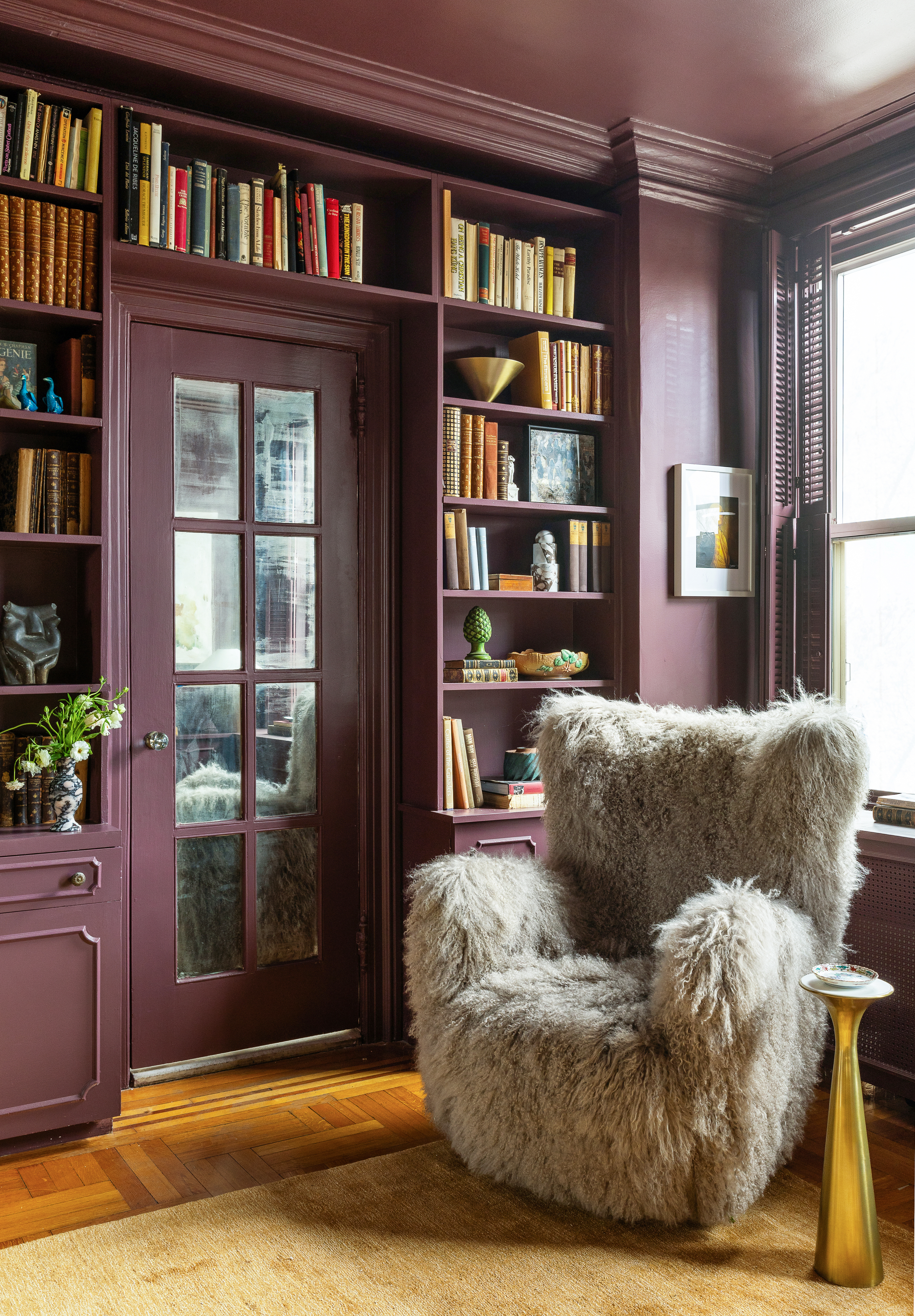 1136 5th Avenue, Unit 6A Manhattan, NY 10128 - Photo 35 of 44 a living room with furniture and a book shelf