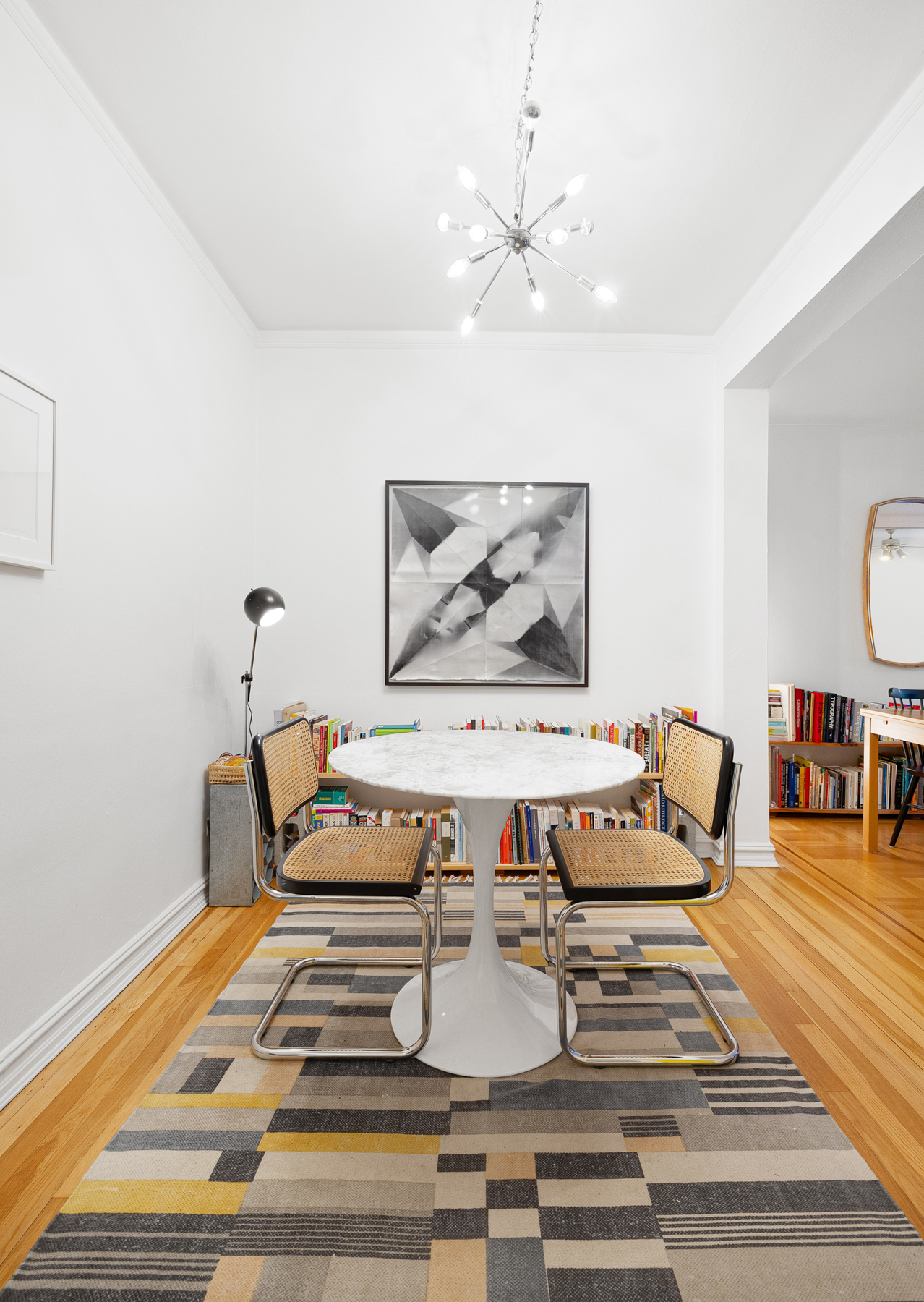 77-11 35th Avenue, Unit 3N Queens, NY 11372 - Photo 9 of 21 a living room with furniture and wooden floor