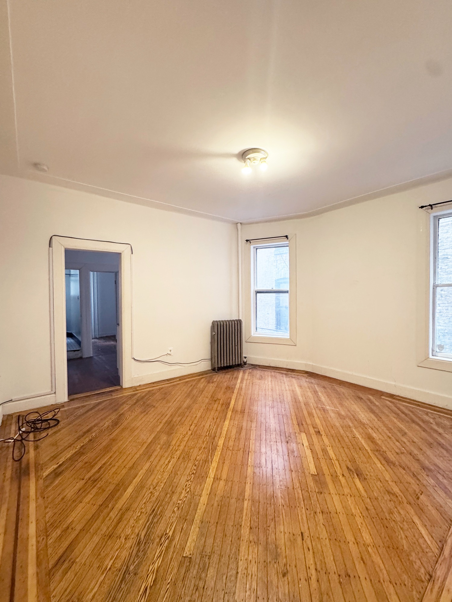 562 7th Street, Unit 3 Brooklyn, NY 11215 - Photo 1 of 6 a view of an empty room and window