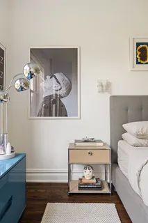 a bathroom with a sink a toilet a mirror and shower