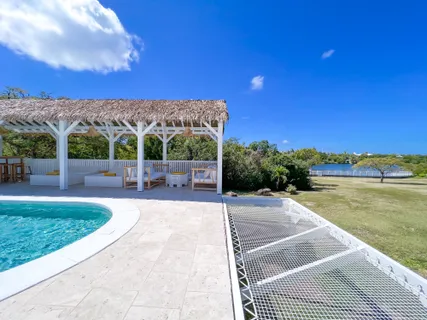 a view of a swimming pool with a patio