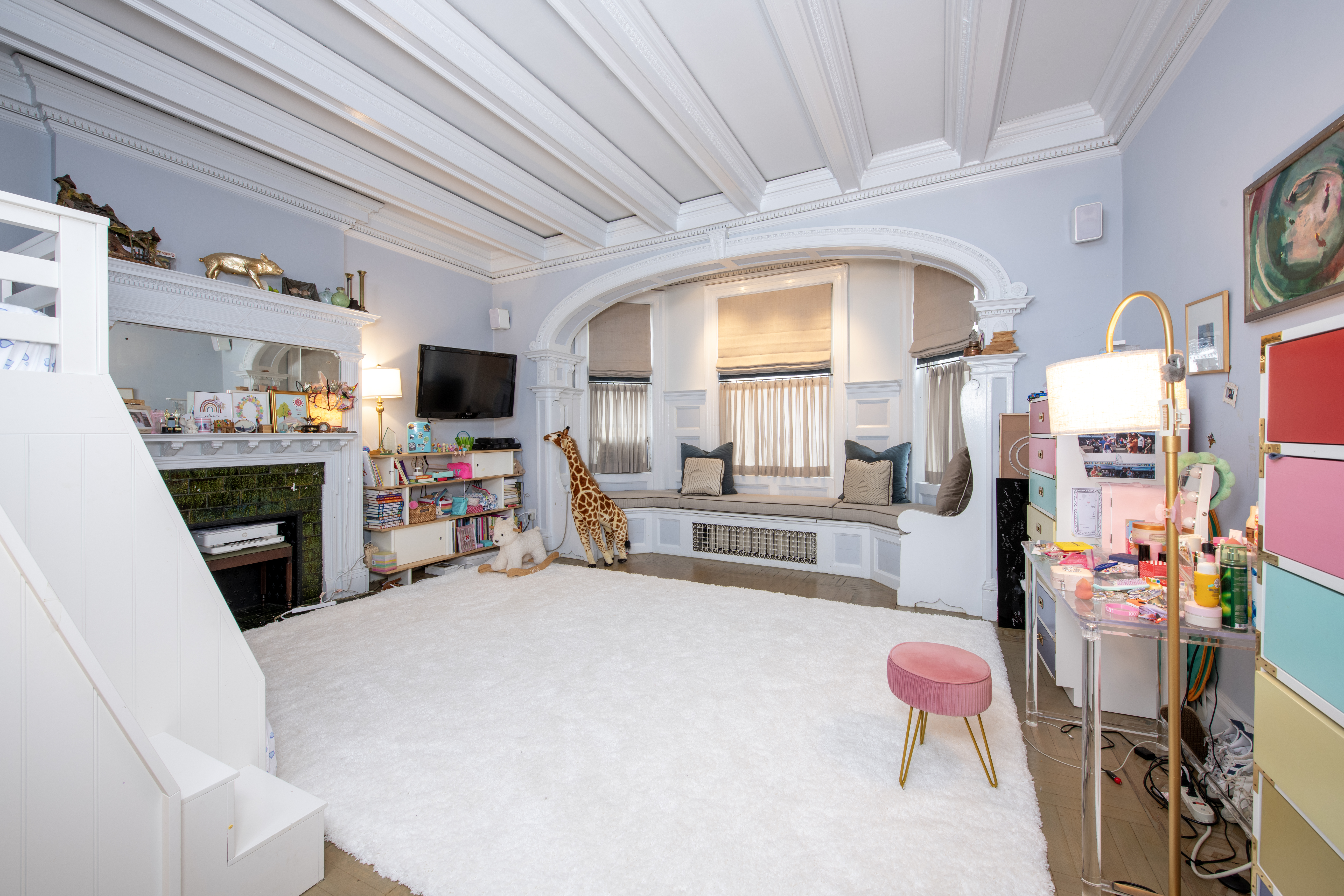 194 Riverside Drive, Unit 5C/6C Manhattan, NY 10025 - Photo 8 of 26 a bedroom with furniture and a flat screen tv