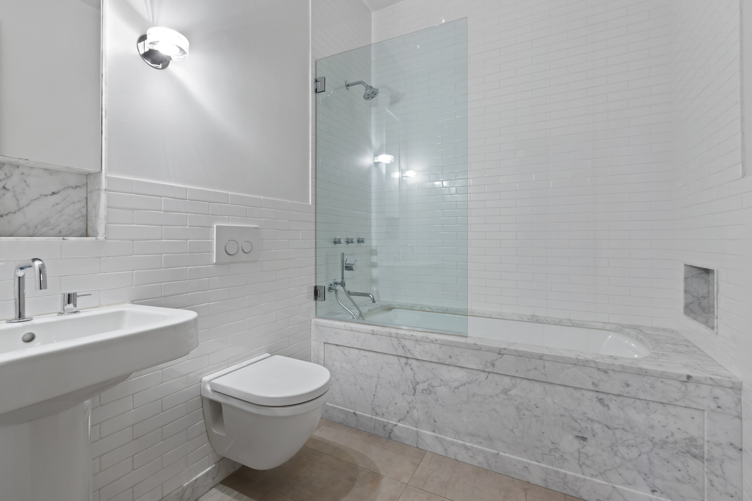 463 Greenwich Street Manhattan, NY 10013 - Photo 14 of 24 a bathroom with a toilet a sink and shower