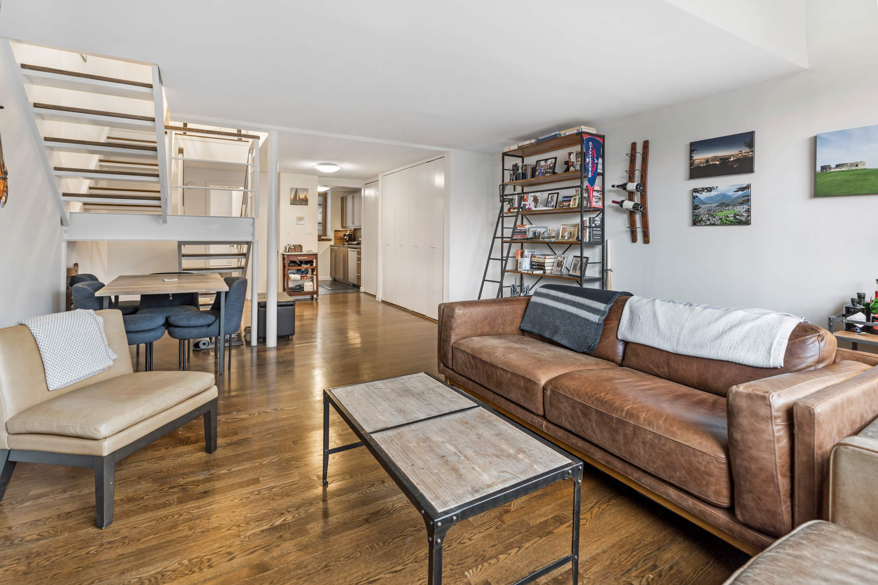305 2nd Avenue, Unit 518 Manhattan, NY 10003 - Photo 7 of 19 a living room with furniture and wooden floor
