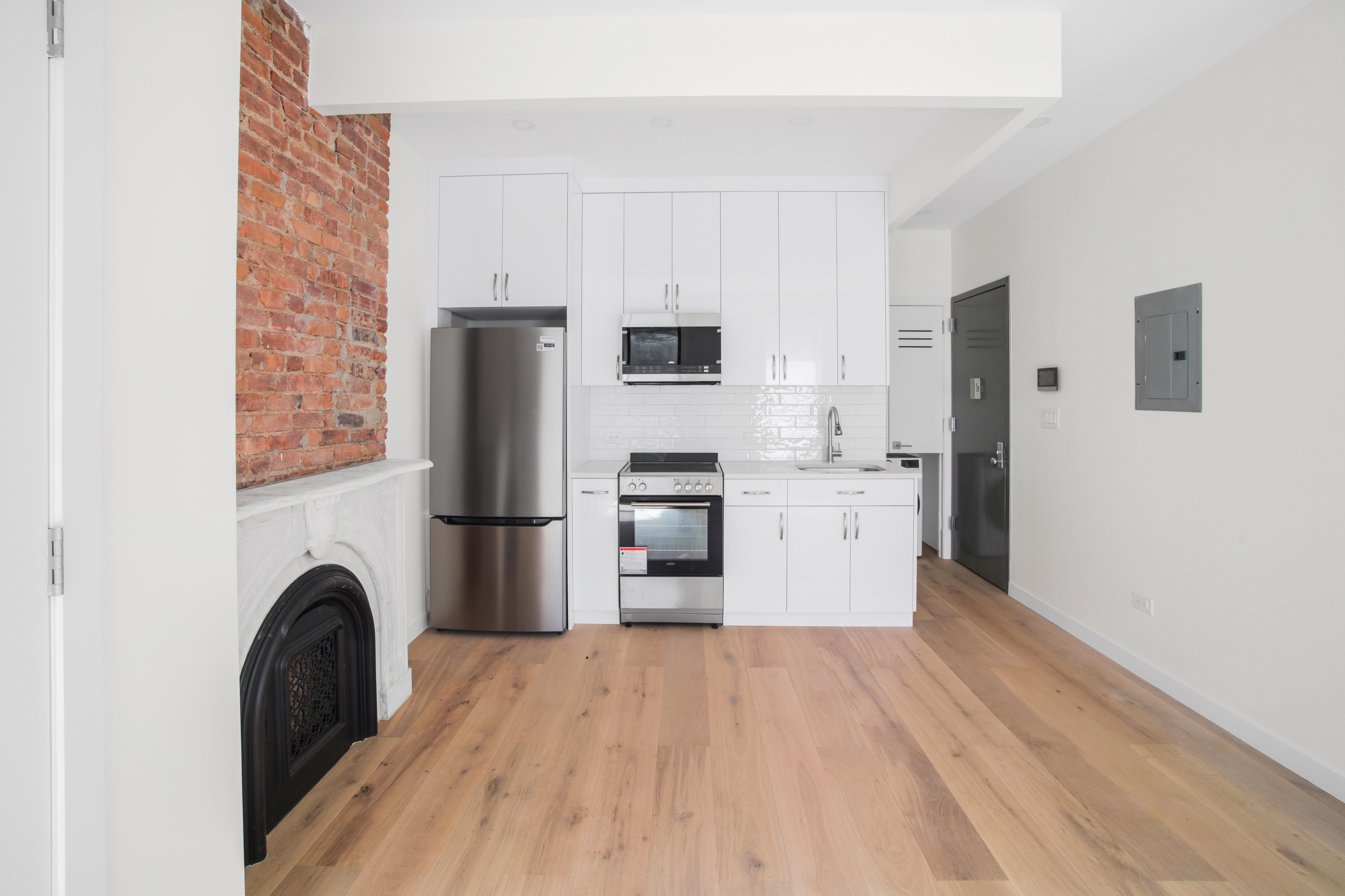 94 6th Avenue, Unit 3F Brooklyn, NY 11217 - Photo 8 of 11 a view of kitchen with refrigerator and stove