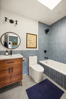 a bedroom with a bed chair and a window