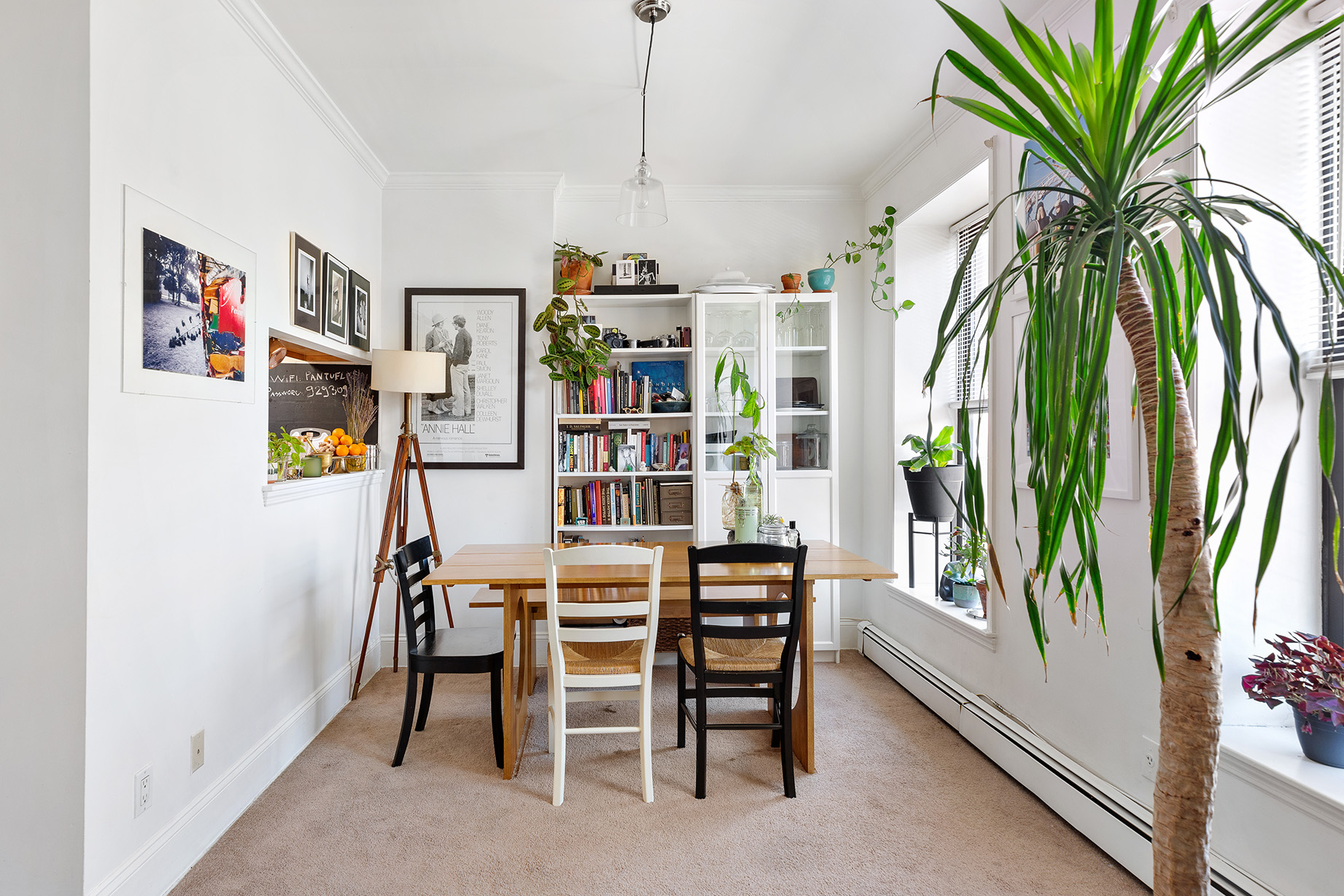 232 Monroe Street Brooklyn, NY 11216 - Photo 15 of 21 a dining room with furniture and a book shelf