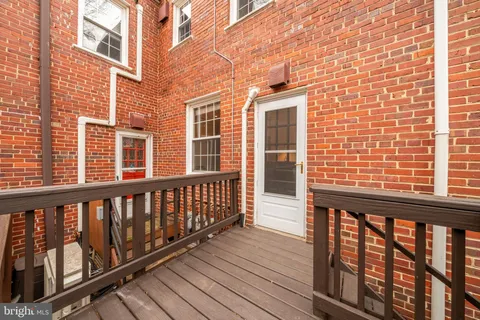 a view of wooden balcony with wooden floor