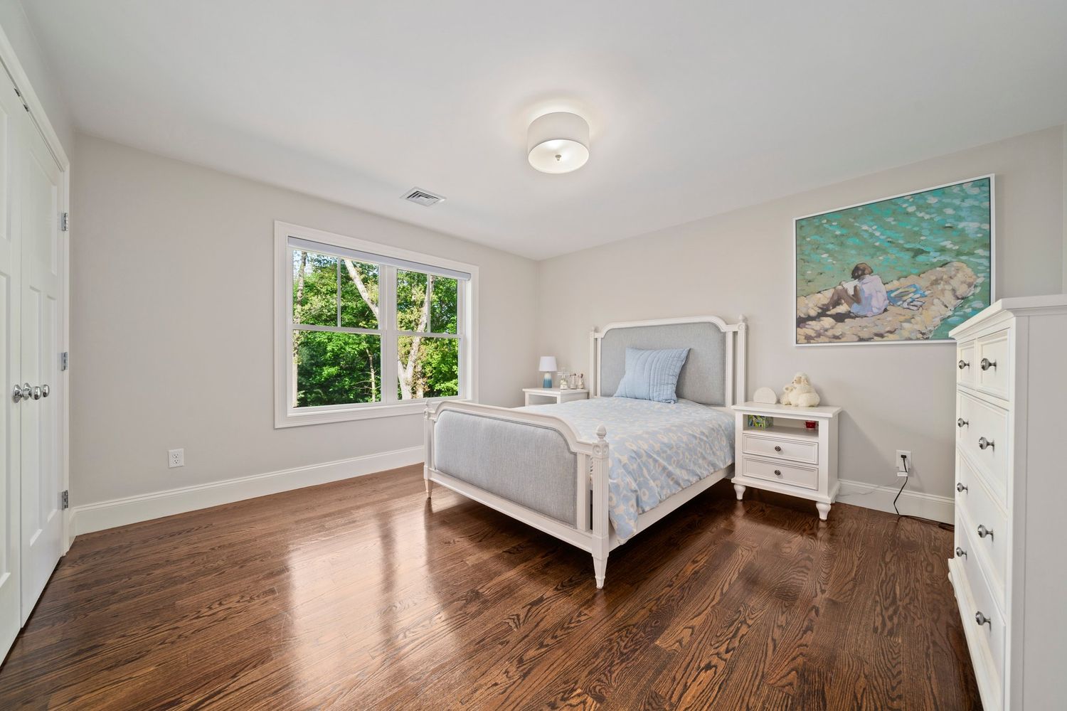 a bedroom with furniture and a book shelf